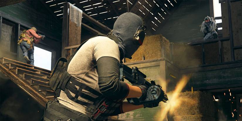 operator with assault rifle in barn