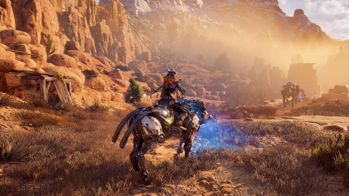 horizon zero dawn aloy riding a mount in the desert region
