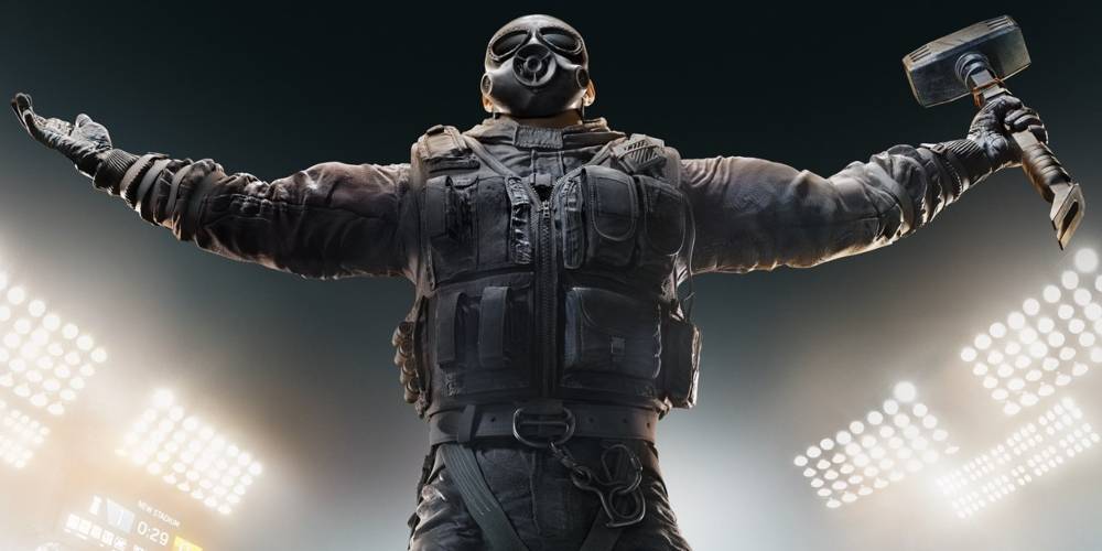 Rainbow Six Siege figreu in uniform and gas mask holding up a hammer