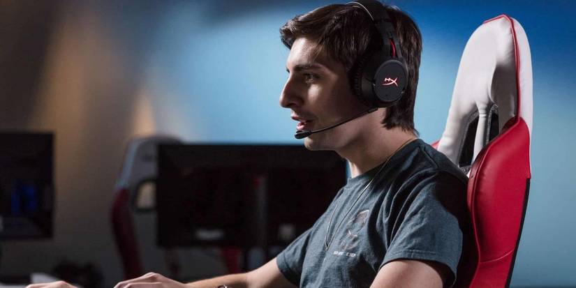 shroud with headset at keyboard in a dxracer