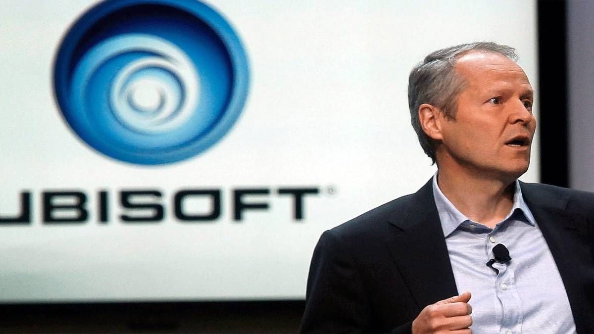 yves guillemot in front of ubisoft logo