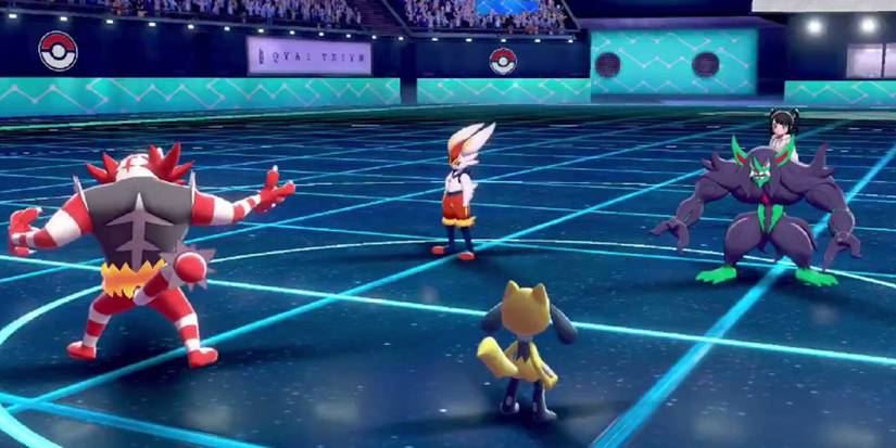 Incineroar, Riolu, Cinderace and Grimmsnarl in a doubles battle in Pokémon Sword and Shield