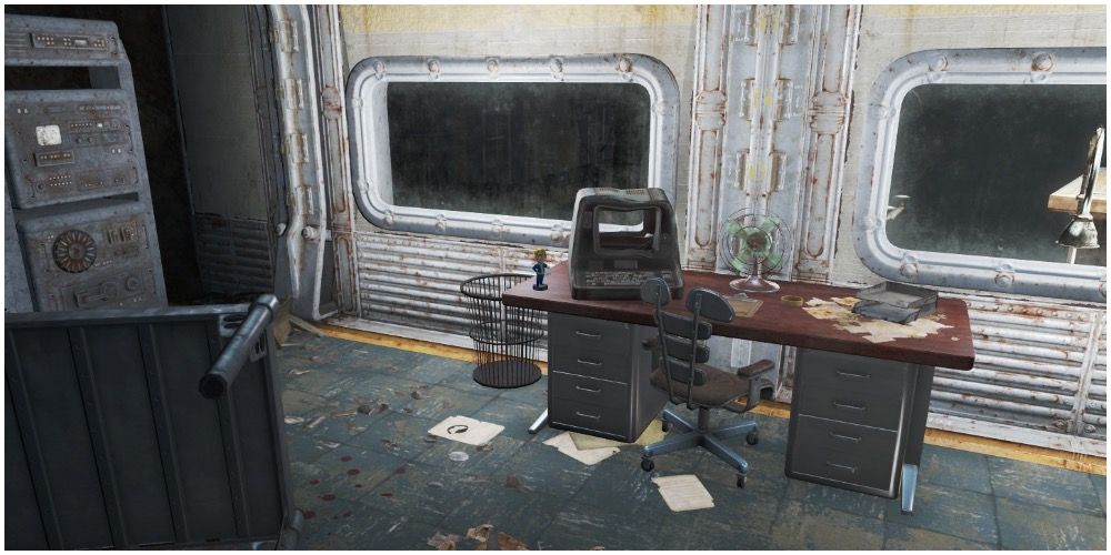 The science bobblehead on a desk in Vault 75