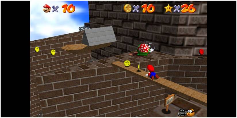 Mario crawling on a plank in Whomp's Fortress.