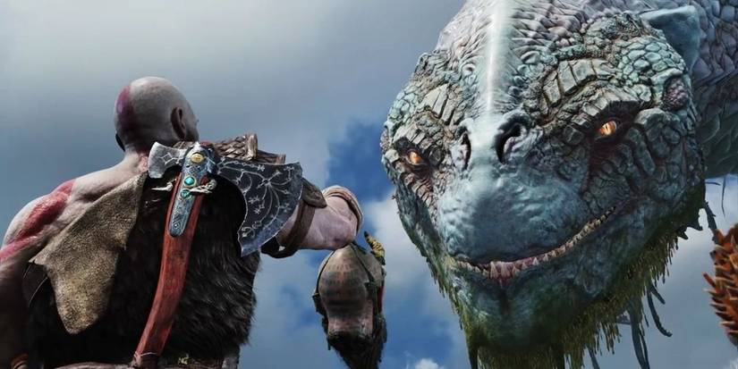 Kratos holding Mimir's head to the World Serpent.