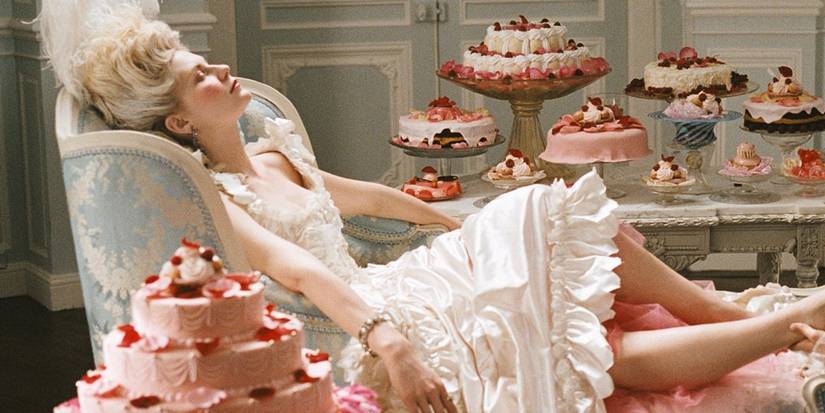 Marie Antoinette relaxes peacefully surrounded by cakes in Marie Antoinette