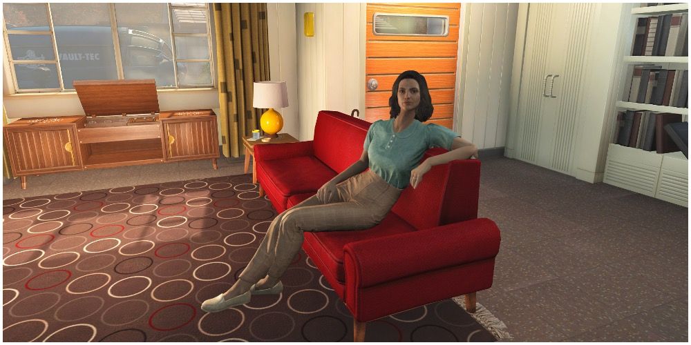 Nora sitting on a couch in her home before the bombs drop