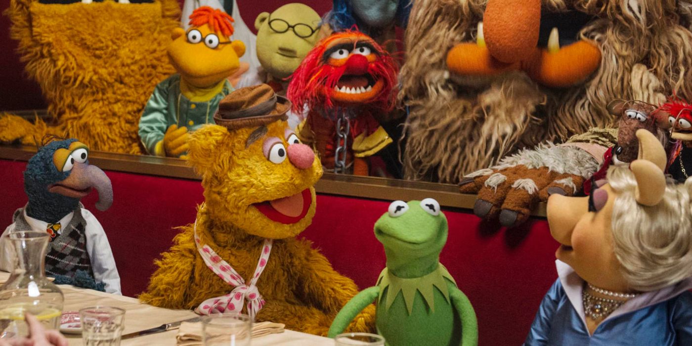 Muppets sitting at a table