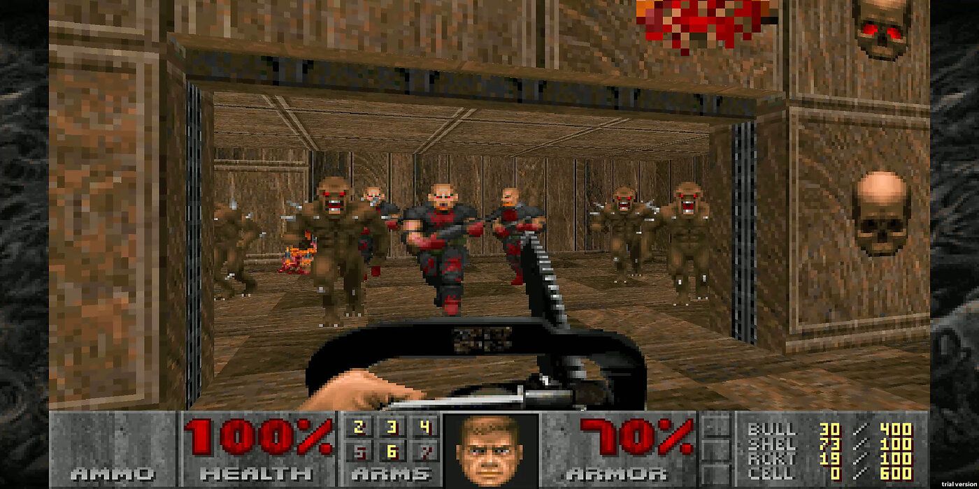 Player being rushed by Demons in the original doom