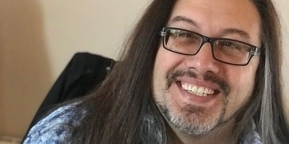 Headshot Of John Romero Smiling In Interview