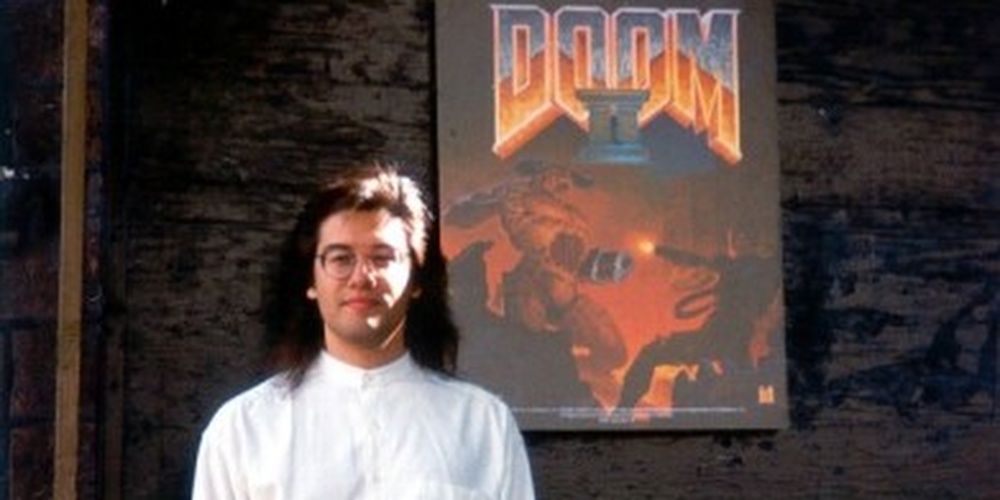 John Romero In Front Of A Doom 2 Poster