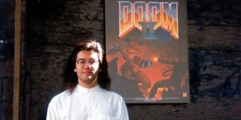 John Romero In Front Of A Doom 2 Poster