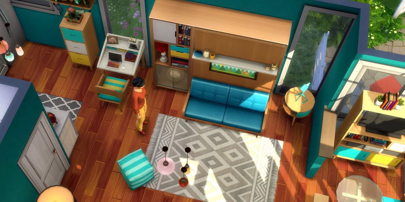 Top down view of a lounge filled with tiny living furniture from The Sims 4