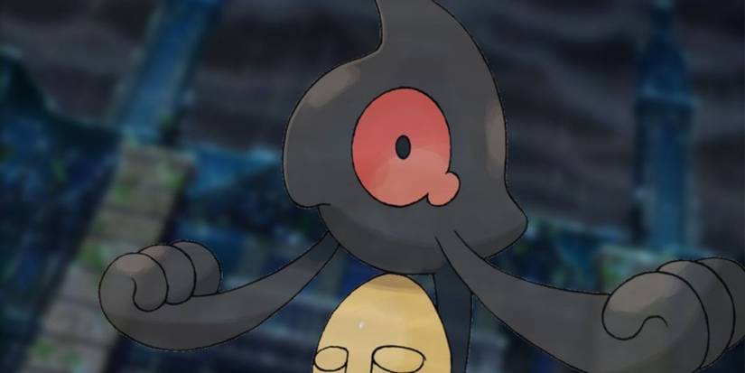 Yamask carrying a facemask 