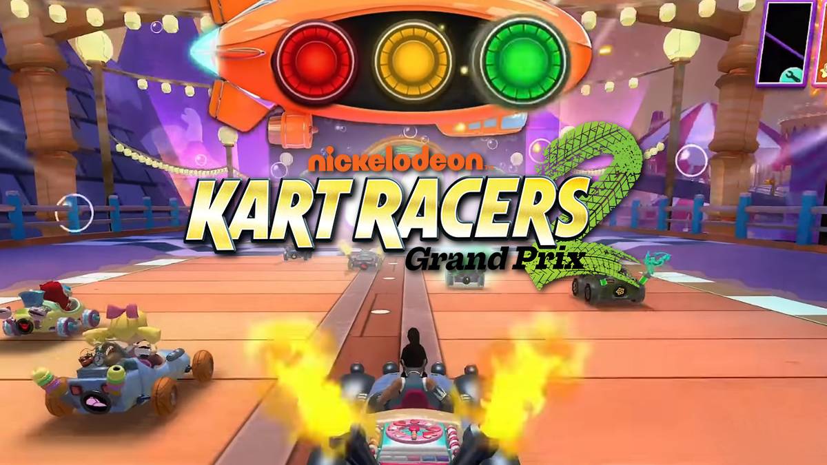 Title: Kart Racers 2 Grand Prix. Fire blasts from the back of a driver's car as the race starts.