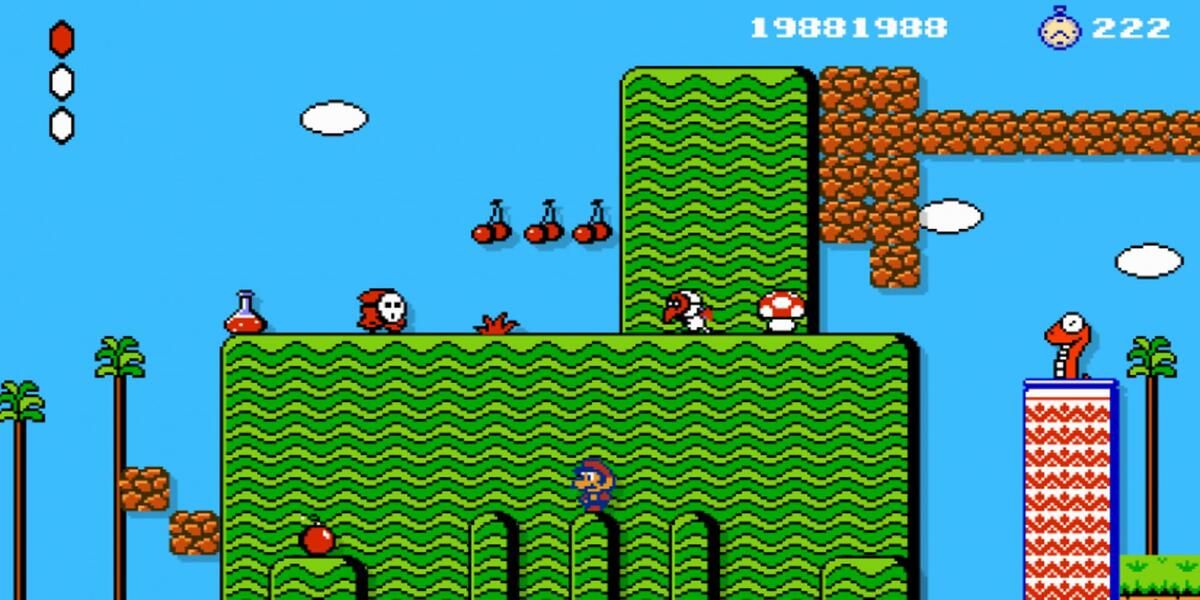 Super Mario Bros 2 gameplay with small Mario in platform below enemies and cherries