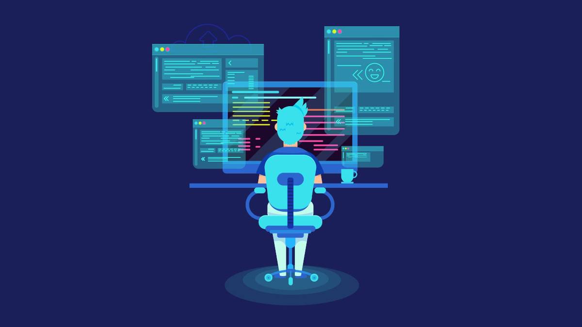 A Unity game developer sits at a computer with a cup of coffee.