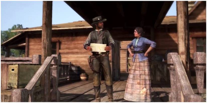 John and Abigail in front of their house