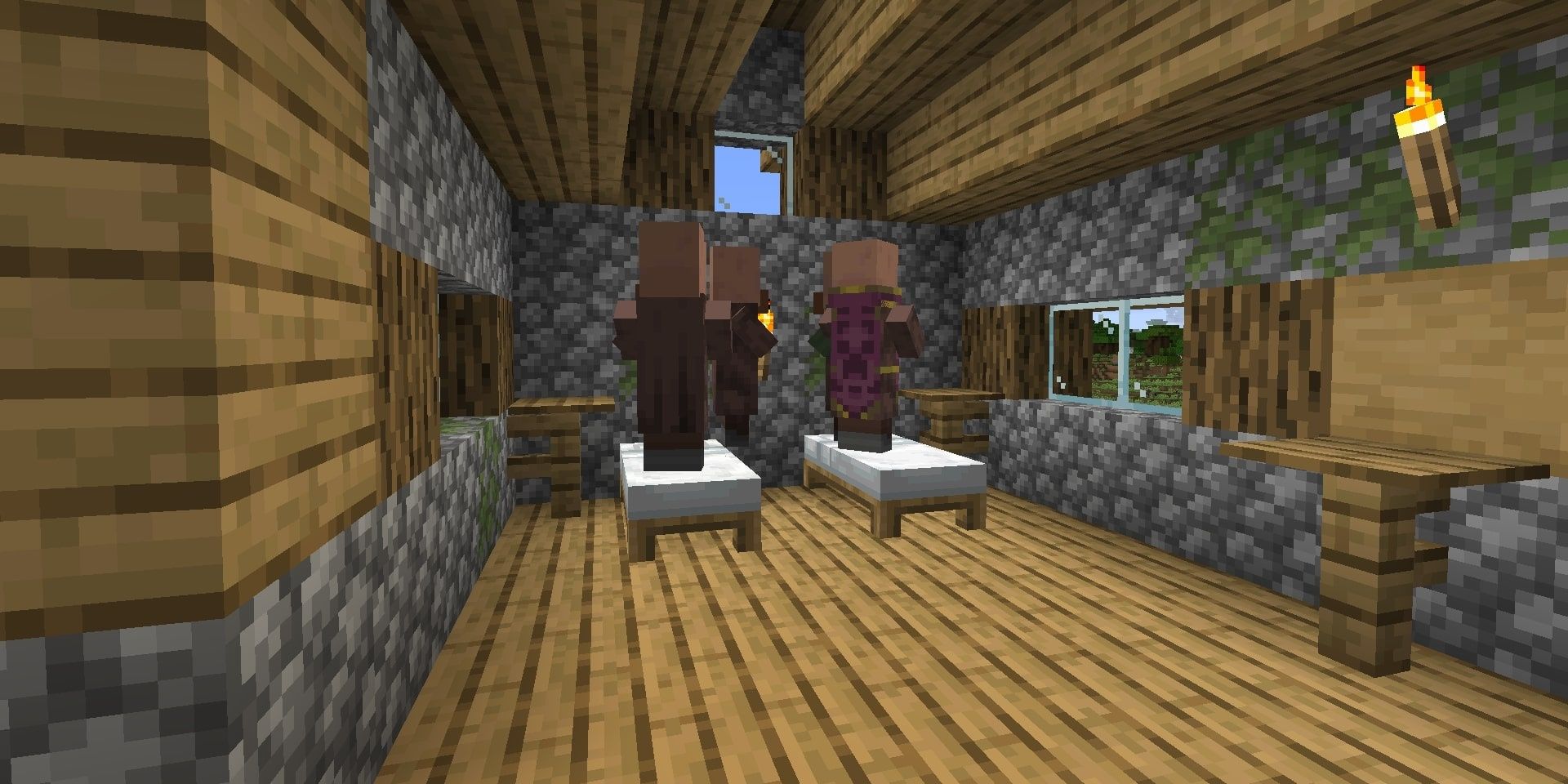 Villagers hiding during a raid in Minecraft