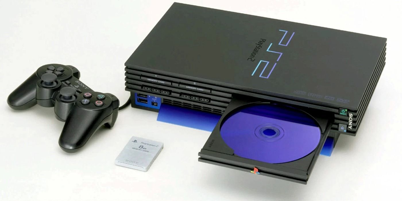 image of a PS2 console with a controller, memory card, and an open disk drive