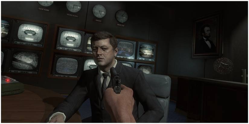 Mason pointing a gun at Kennedy