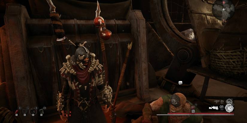 Standing in front of weapons rack