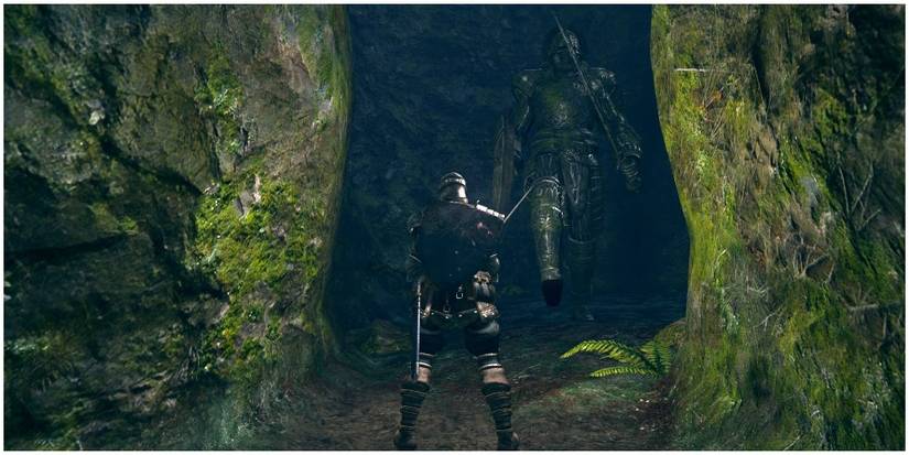 Dark Souls warrior in narrow passage with Stone Guardian