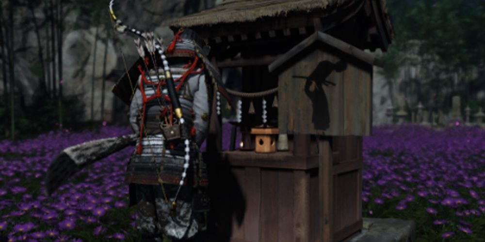 Jin bows to shrine in Ghost of Tsushima