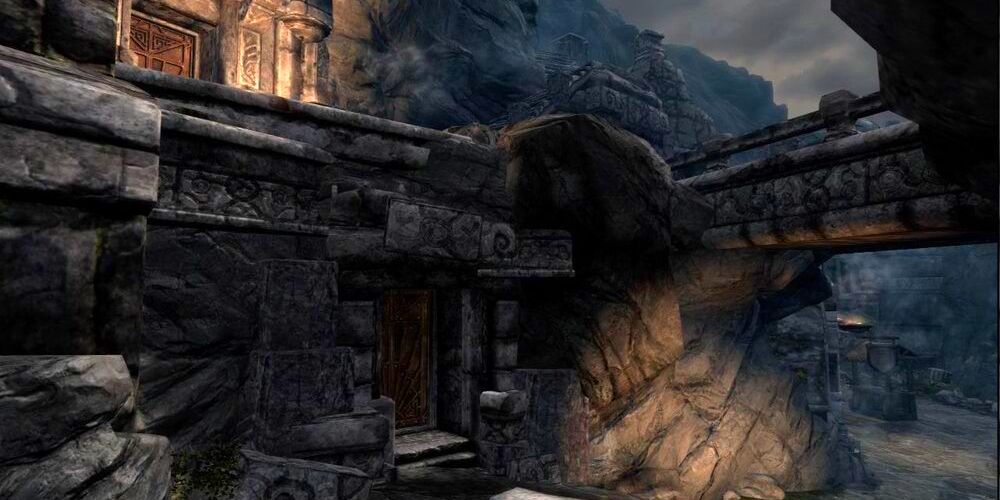 house built into the stone under a bridge in markarth of skyrim