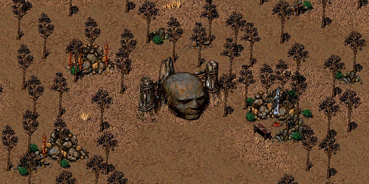stone head in the middle of some trees in fallout 2's wastelands