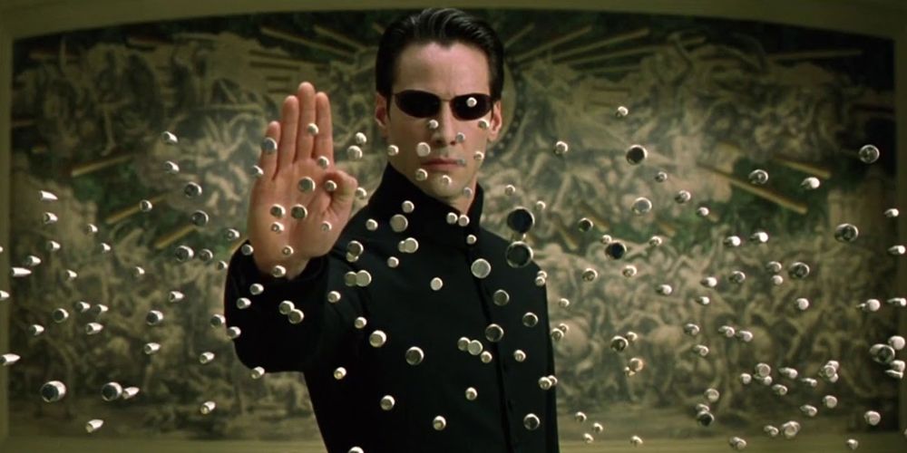 Neo stopping bullets with his mind in The Matrix