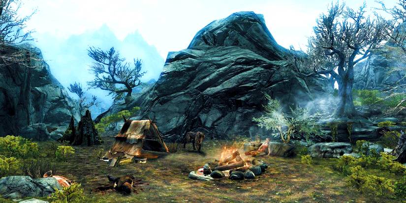 a camp with a lit fire