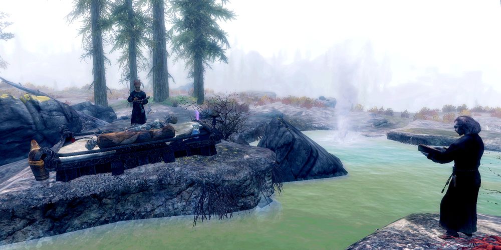 necromancers performing magic at an altar upon a corpse in a misty area in skyrim