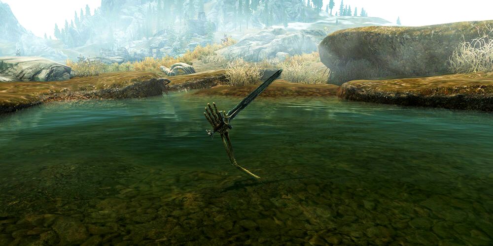 bone arm holding a sword in a pond