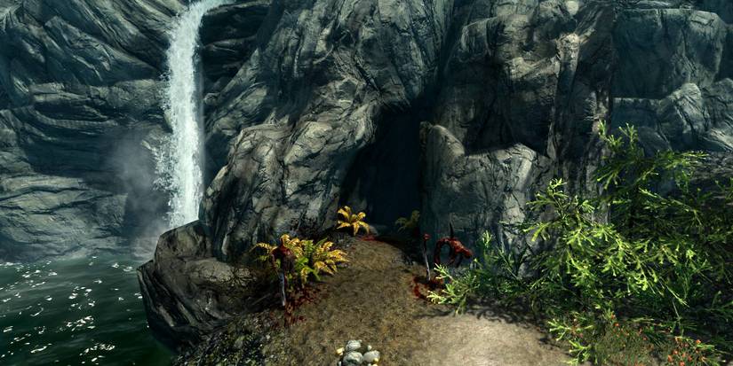 cave entrance by a waterfall