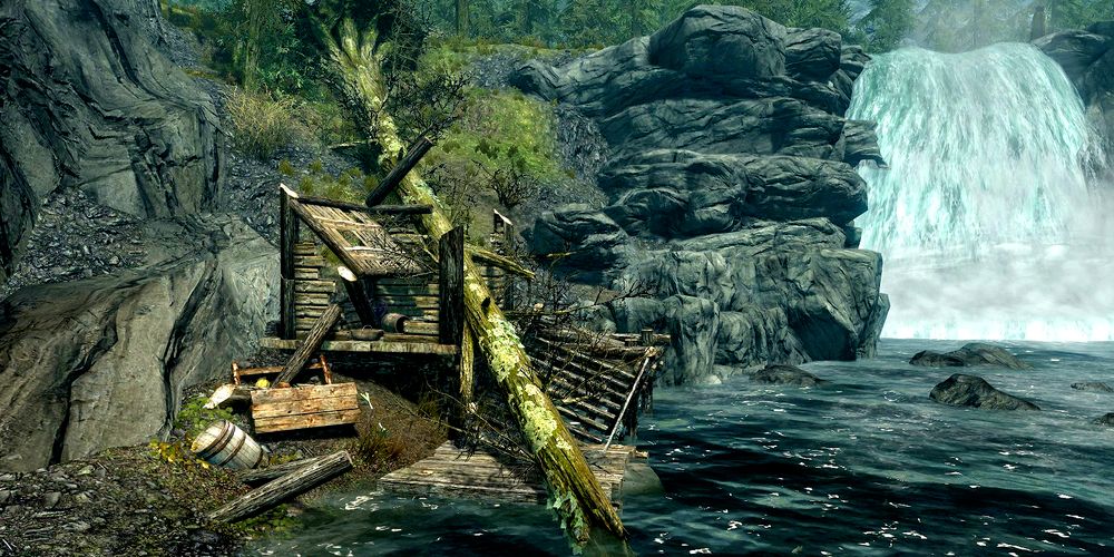small wooden shack smashed to pieces by a fallen tree by a stream in skyrim.