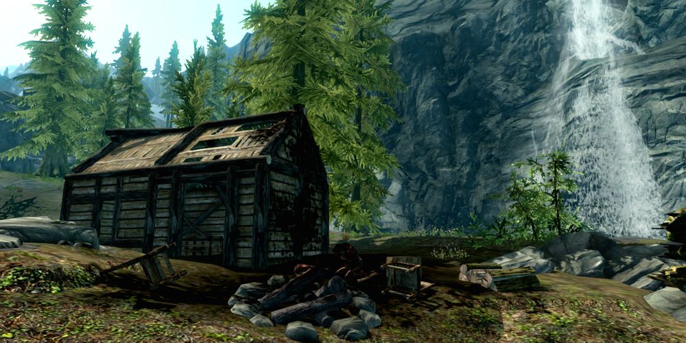 burnt cabin by a waterfall in skyrim