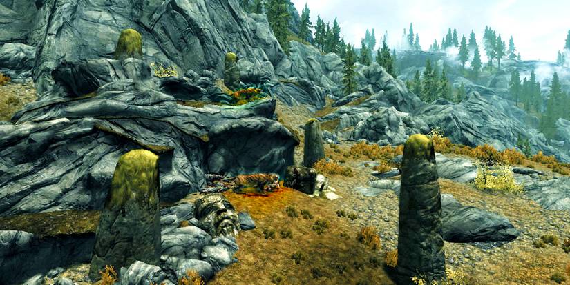 two sabre cats hunting in a rocky area