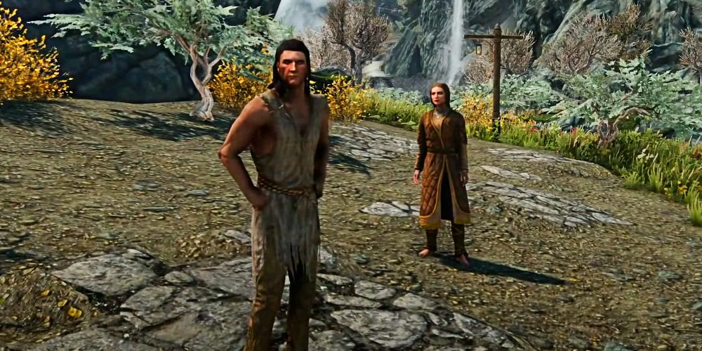man and woman in skyrim standing on a road