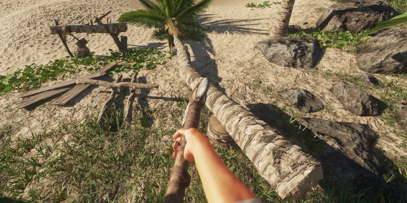stranded deep character chopping wood from palm tree