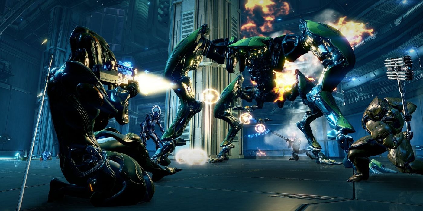 warframe team attacking enemy with guns and melee weapons