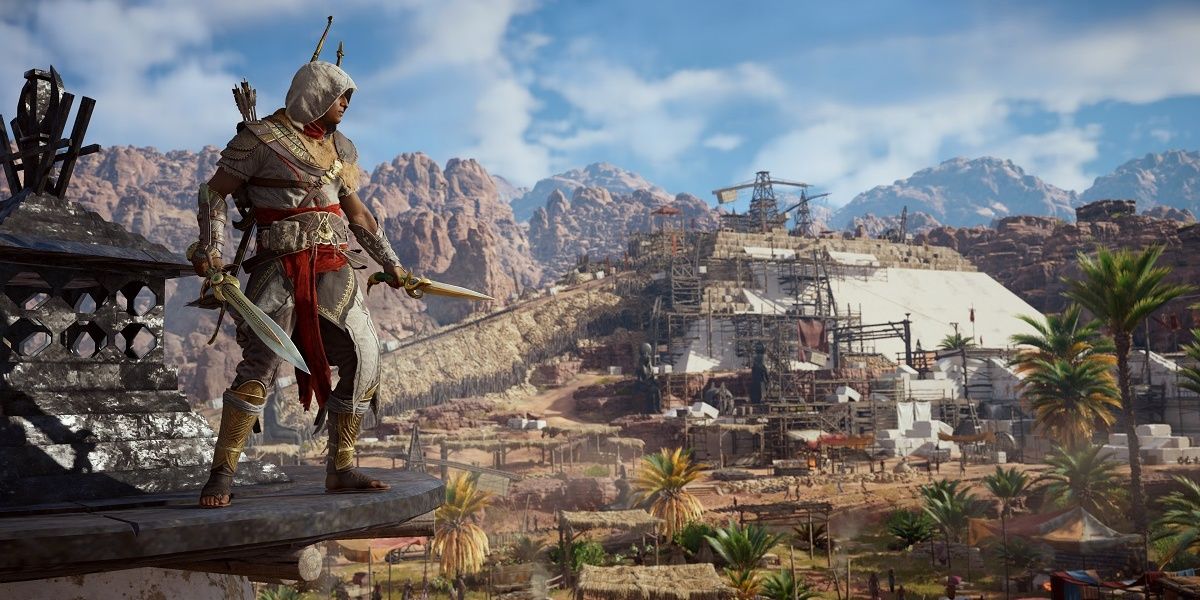 Bayek overlooks a settlement in Assassin's Creed Origins
