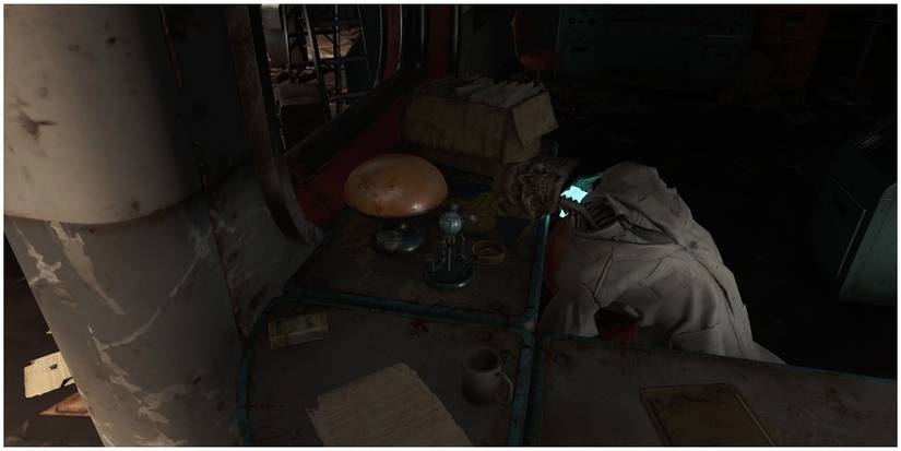 A collectable Mister Handy on the desk of a skeleton