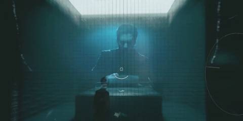 Alan Wake typing at a keyboard in Control