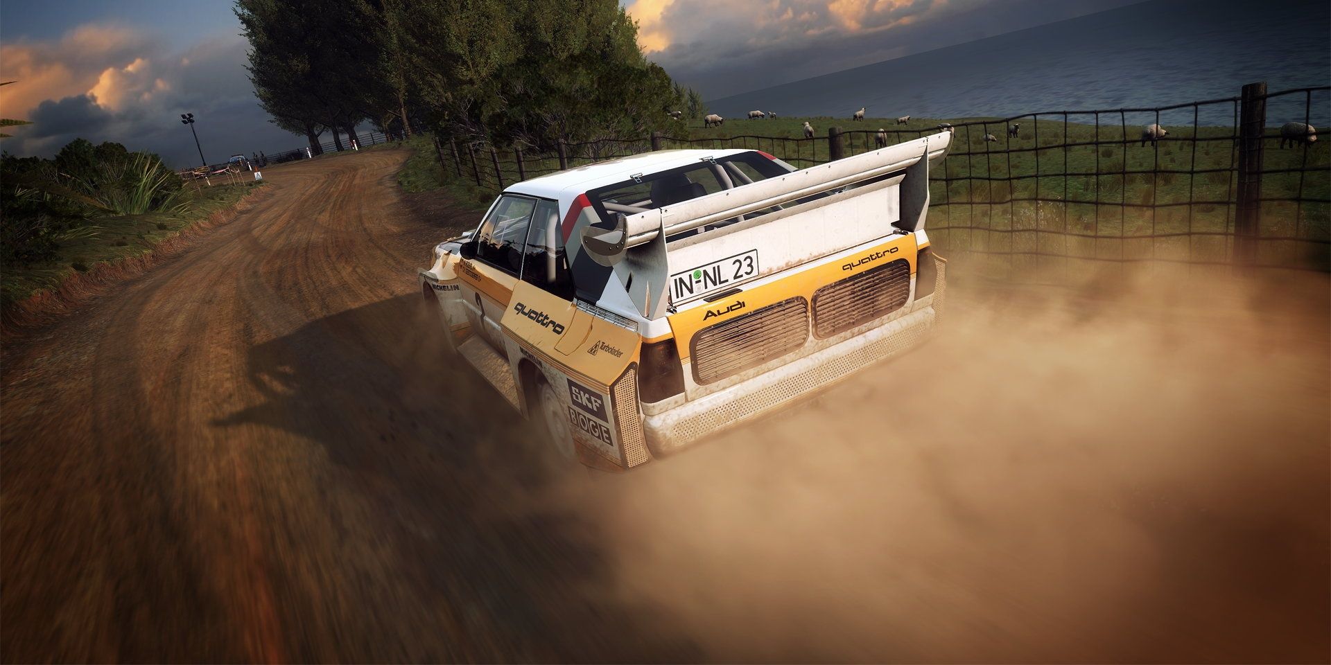 A vehicle driving down a dirt path in DiRT Rally