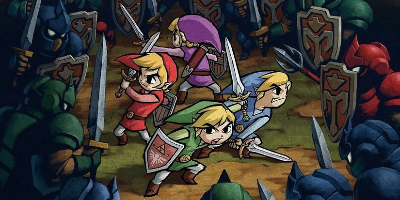 The four links fighting enemies in Zelda Four Swords Adventures 