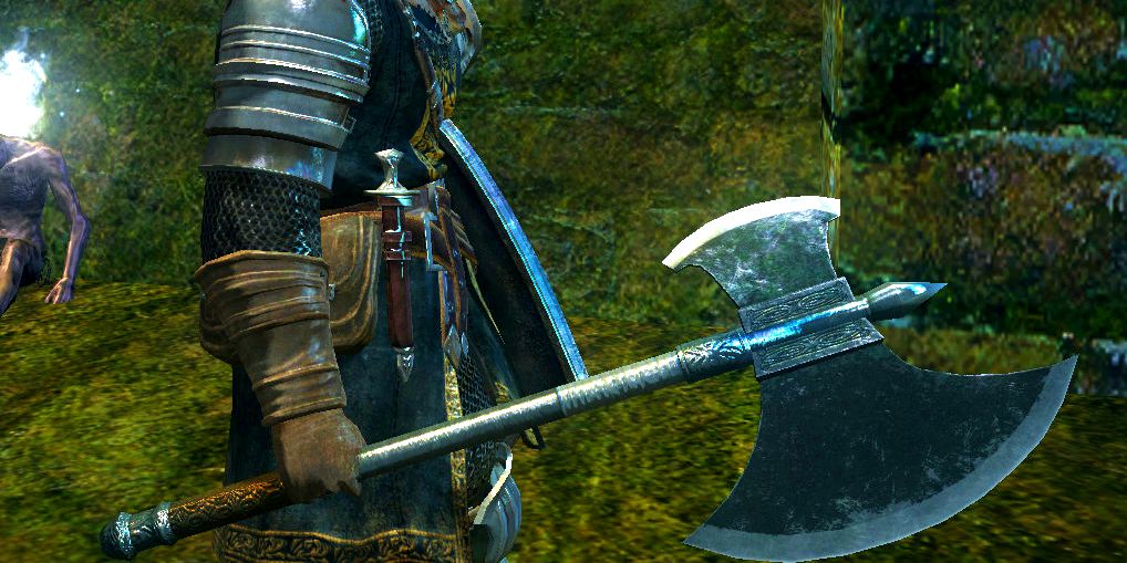 player holding a metal axe in one hand