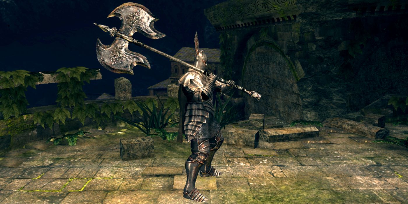 player in silver knight armor holding the black knight greataxe on a stone bridge