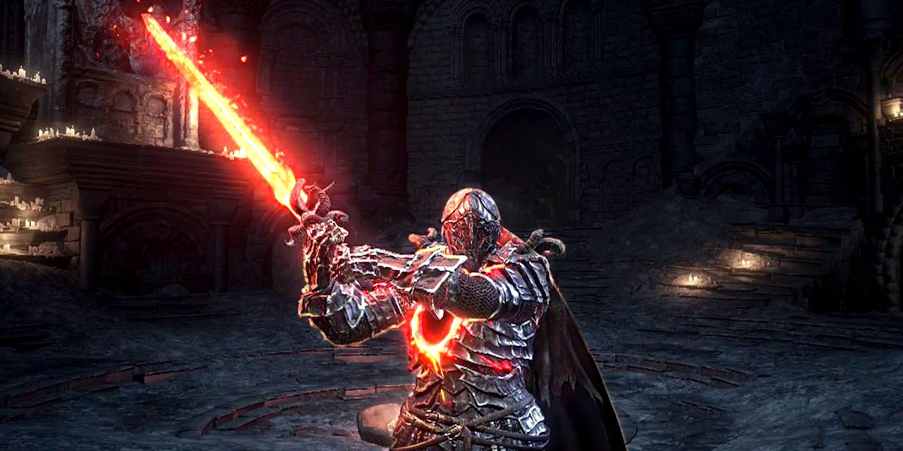 player holding the flaming sword during the weapon stance and wearing ringed knight armor.