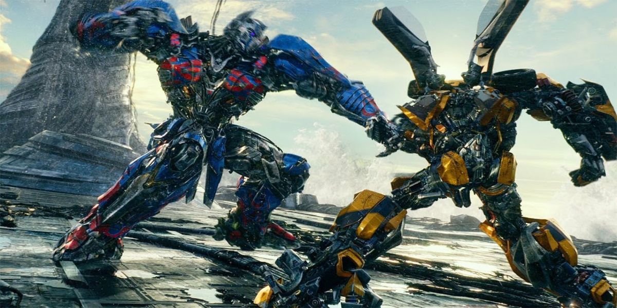 optimus setting up to punch bumblebee